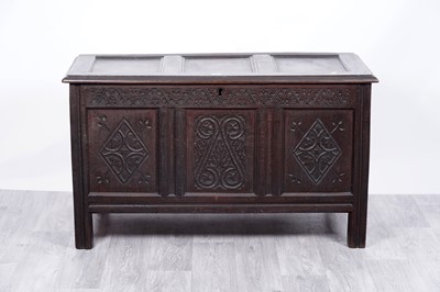 Lot 22 - An 18th Century carved oak coffer