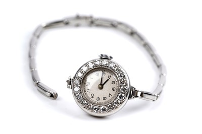 Lot 453 - A diamond set platinum cased cocktail watch