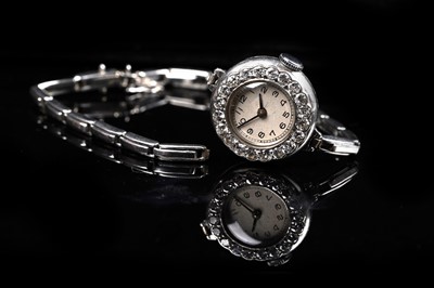 Lot 453 - A diamond set platinum cased cocktail watch
