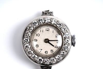 Lot 453 - A diamond set platinum cased cocktail watch