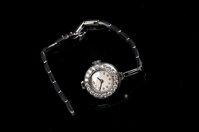 Lot 453 - A diamond set platinum cased cocktail watch