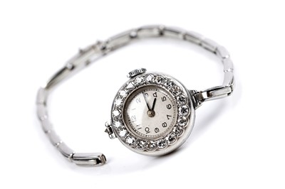 Lot 453 - A diamond set platinum cased cocktail watch