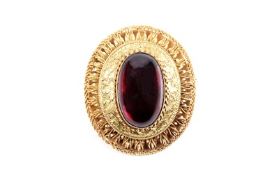 Lot 509 - A Victorian garnet and yellow gold locket brooch