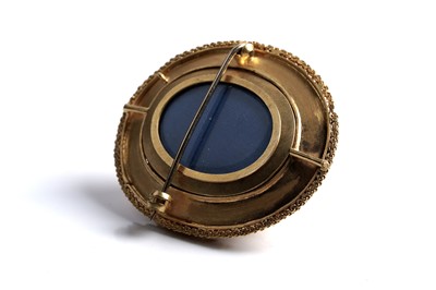 Lot 509 - A Victorian garnet and yellow gold locket brooch