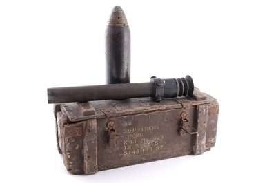 Lot 90 - A Second World War six-pounder gun-sight, a shell and box
