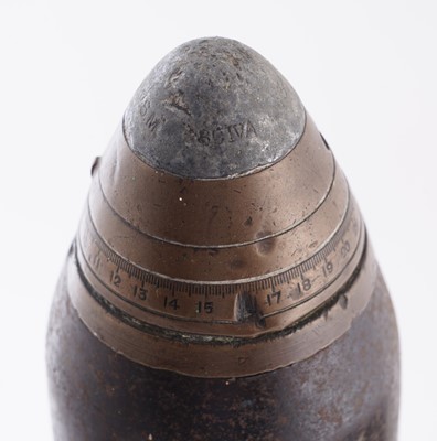 Lot 90 - A Second World War six-pounder gun-sight, a shell and box