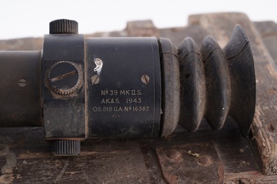 Lot 90 - A Second World War six-pounder gun-sight, a shell and box