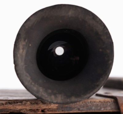 Lot 90 - A Second World War six-pounder gun-sight, a shell and box