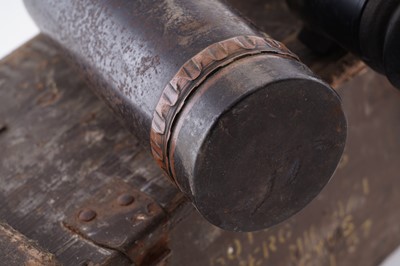 Lot 90 - A Second World War six-pounder gun-sight, a shell and box
