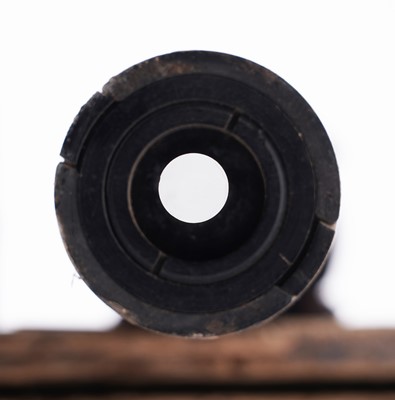 Lot 90 - A Second World War six-pounder gun-sight, a shell and box