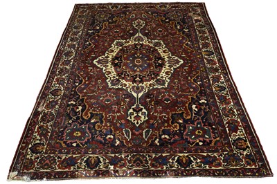 Lot 957 - A mid-20th Century Persian hand-knotted Heriz carpet