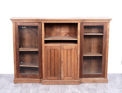 Lot 86 - A vintage stripped pine breakfront bookcase