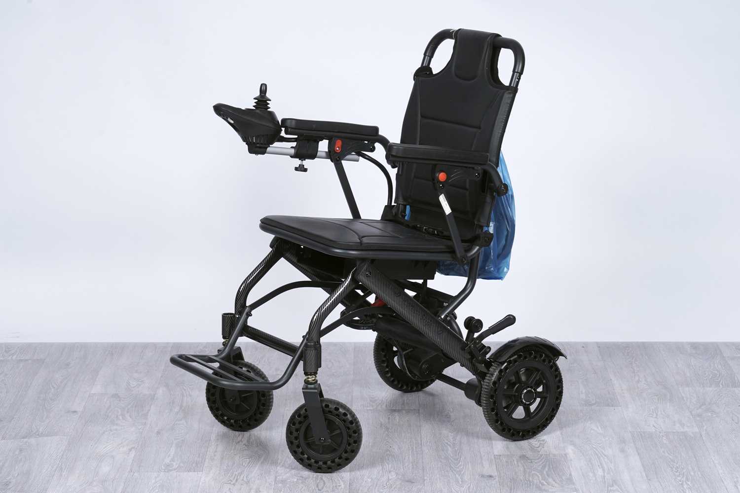 Lot 460 - An unbranded carbon fibre effect mobility chair
