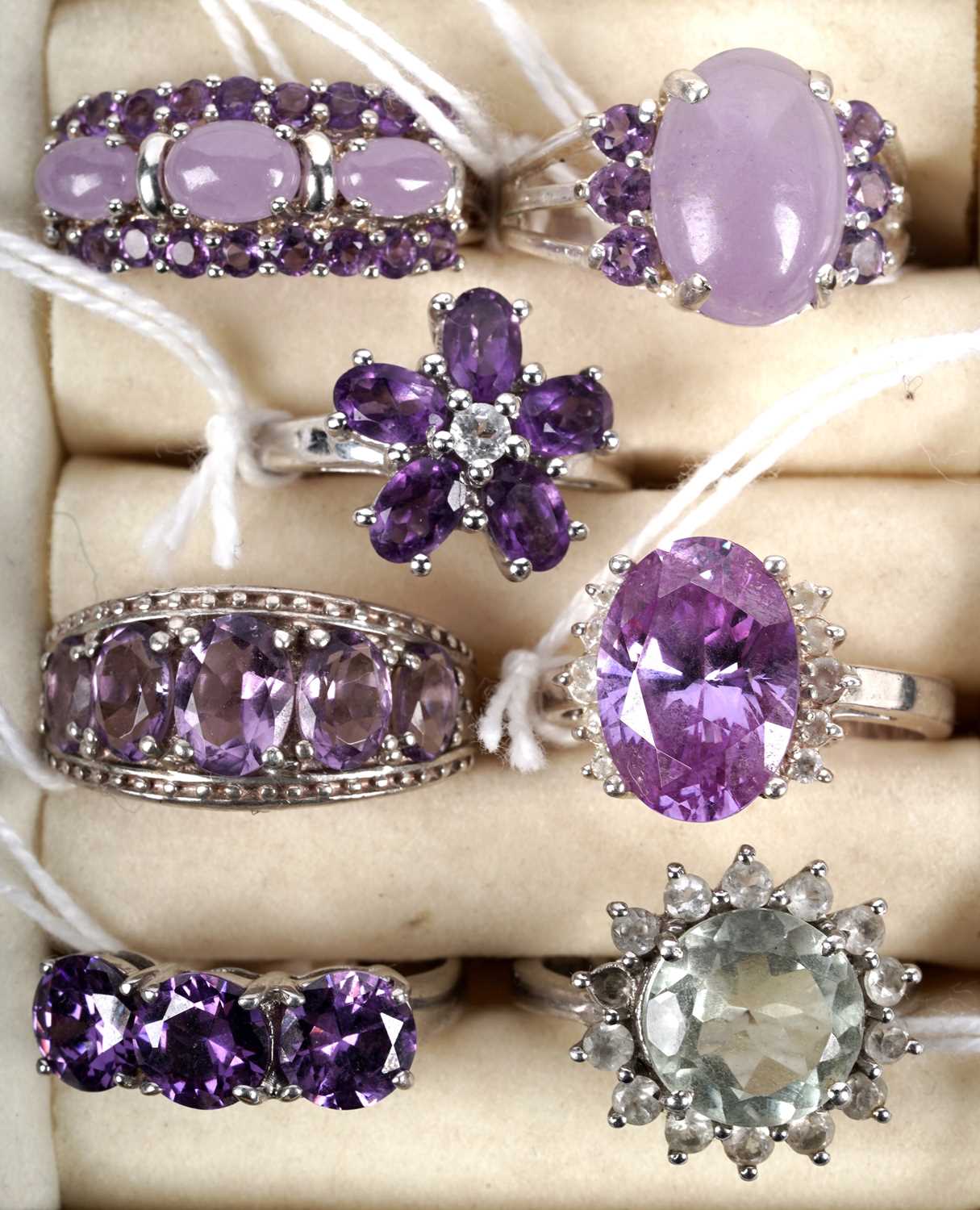 Lot 158 - A collection of amethyst and purple jade rings