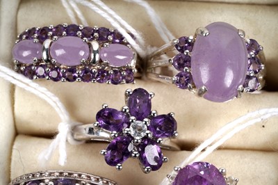Lot 158 - A collection of amethyst and purple jade rings