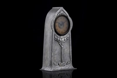 Lot 1009 - David Veasey for Liberty & Co.: a Tudric pewter 'Tree of Life' decorated mantel clock
