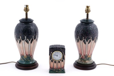 Lot 179 - A pair of Moorcroft ‘Cluny’ pattern table lamps; and a Moorcroft ‘Cluny’ pattern mantle clock