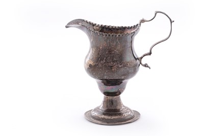 Lot 110 - A George III silver cream jug