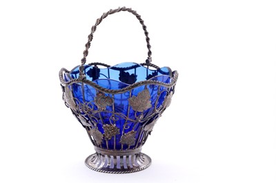 Lot 111 - A George III silver wirework sugar basket
