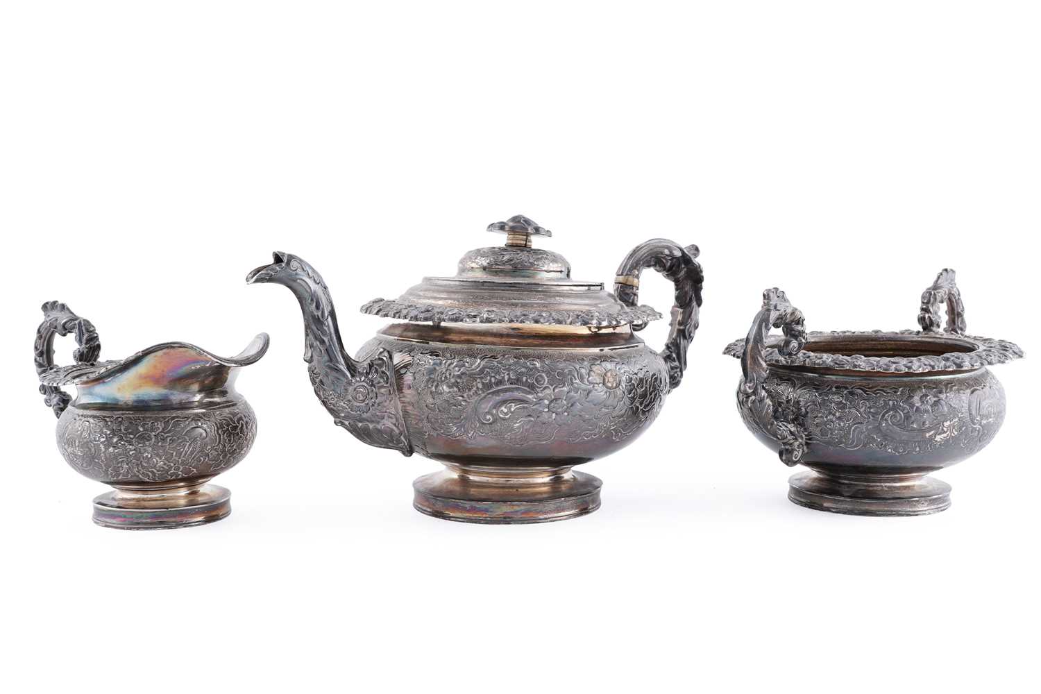 Lot 114 - A late George III silver three piece tea service