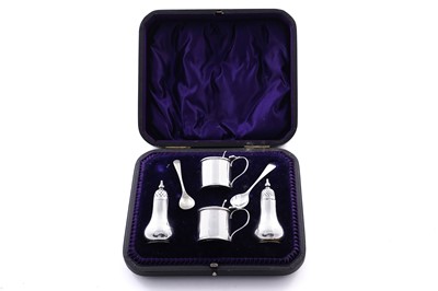 Lot 364 - A cased Edwardian silver four-piece condiment set; and two associated plated spoons