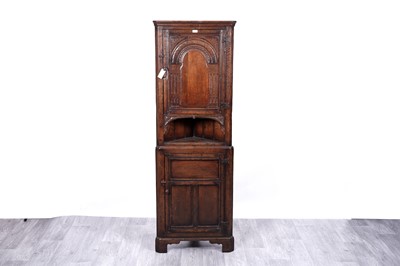 Lot 11 - Titchmarsh & Goodwin, retailed by N. H. Chapmans: an RL33/N oak floor standing corner cabinet