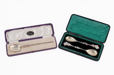 Lot 132 - A George V cased silver gilt replica of the coronation spoon; and two cased silver spoons
