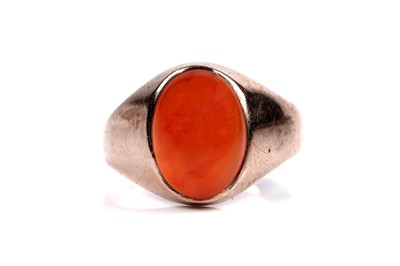 Lot 57 - A carnelian cabochon ring