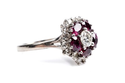 Lot 538 - A ruby and diamond cluster ring