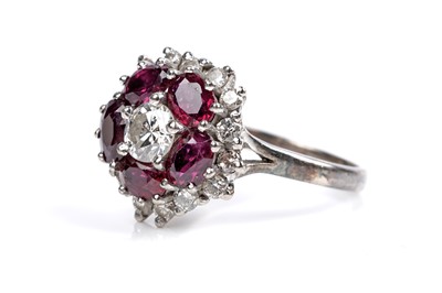 Lot 538 - A ruby and diamond cluster ring