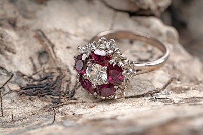 Lot 538 - A ruby and diamond cluster ring