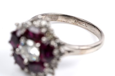 Lot 538 - A ruby and diamond cluster ring