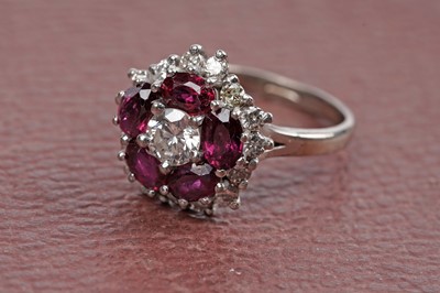 Lot 538 - A ruby and diamond cluster ring