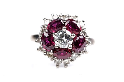 Lot 538 - A ruby and diamond cluster ring