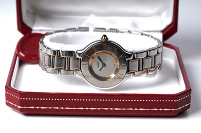 Lot 444 - Must de Cartier 21: a steel and gilt cased lady's quartz wristwatch