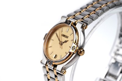 Lot 457 - Gucci: a steel and gilt cased quartz lady's wristwatch