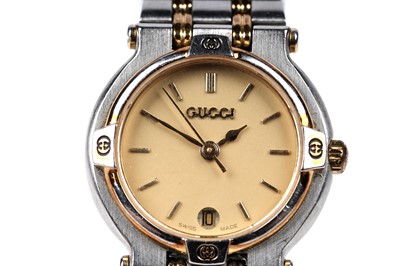 Lot 457 - Gucci: a steel and gilt cased quartz lady's wristwatch