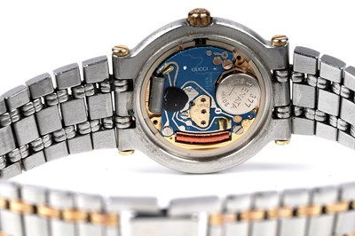 Lot 457 - Gucci: a steel and gilt cased quartz lady's wristwatch