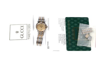 Lot 457 - Gucci: a steel and gilt cased quartz lady's wristwatch