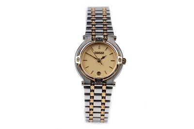 Lot 457 - Gucci: a steel and gilt cased quartz lady's wristwatch