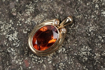 Lot 34 - A contemporary citrine and diamond pendant