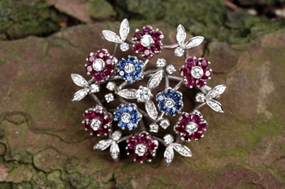 Lot 516 - Manor of Cartier: a mid-20th Century ruby, sapphire and diamond floral brooch