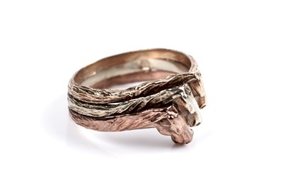 Lot 38 - A 1970's tricolour 9ct gold ring depicting three horse heads