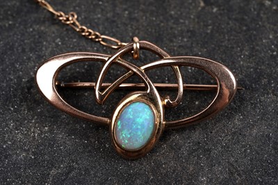 Lot 9 - An Art Nouveau opal and 9ct rose gold brooch