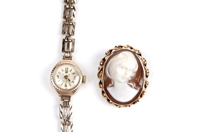 Lot 226 - A carved shell brooch; and a lady's 9ct gold Avia cocktail watch