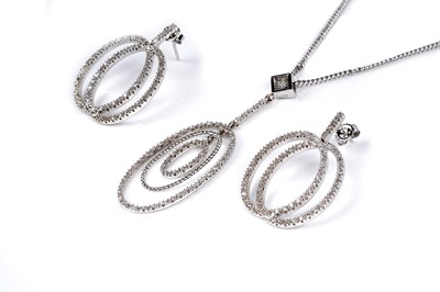 Lot 544 - A diamond pendant necklace and earrings