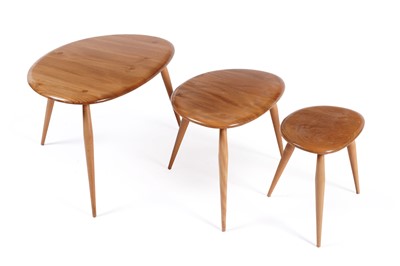 Lot 518 - Lucian Ercolani for Ercol: a model 354 ‘Pebble’ nest of three elm topped occasional tables