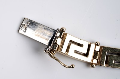 Lot 551 - An 18ct yellow and white gold Greek-Key pattern necklace