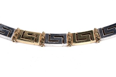 Lot 551 - An 18ct yellow and white gold Greek-Key pattern necklace