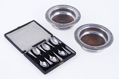 Lot 326 - A cased set of six silver teaspoons; and two wine bottle coasters